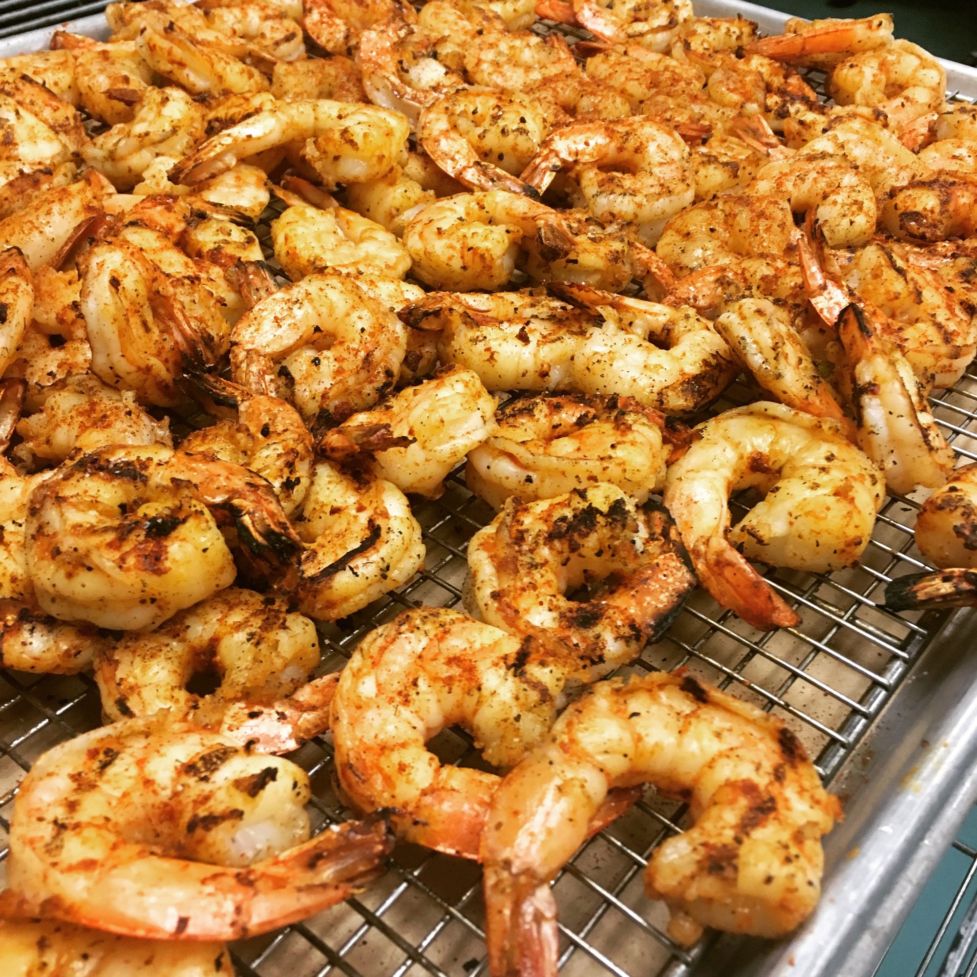 A tray of grilled shrimp